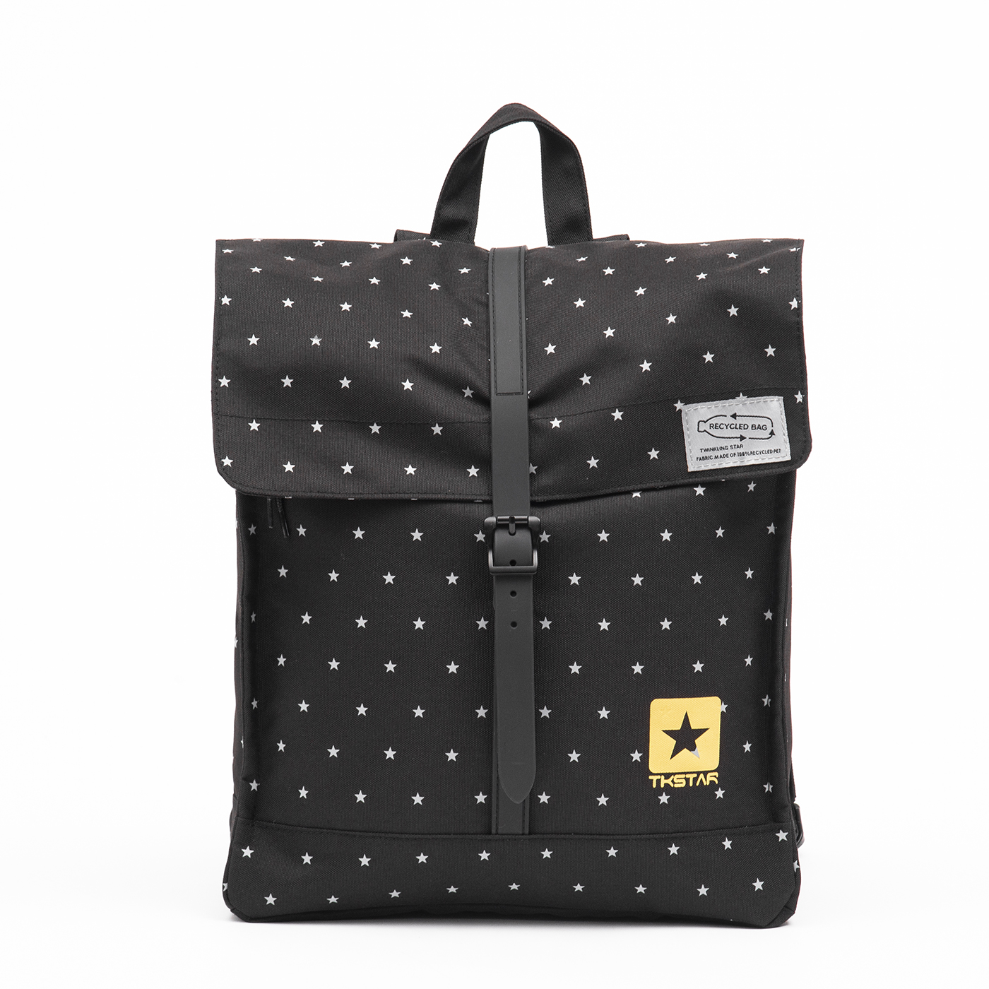 This backpack features a rectangular, minimalist design with a flap closure. It has an off-black background with small star patterns, adding a playful touch. 